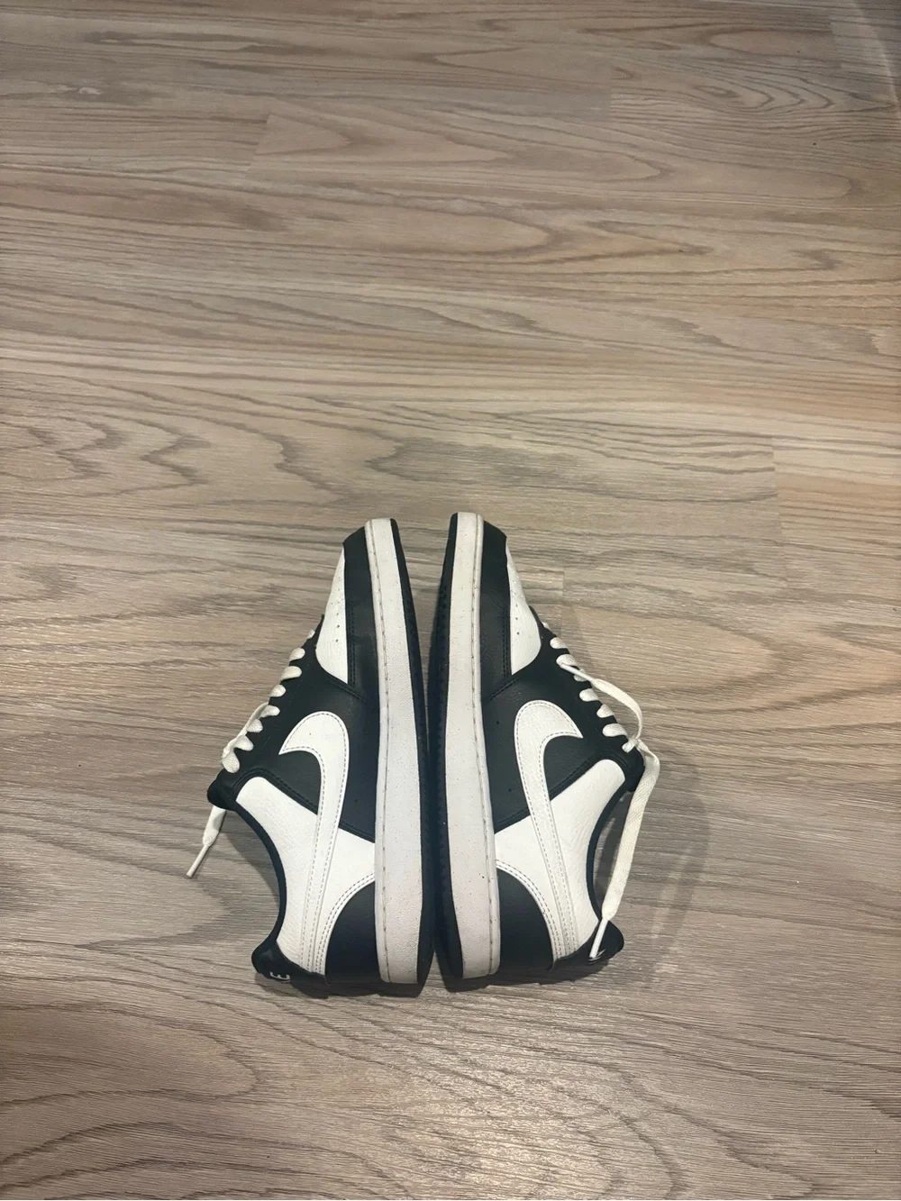 Nike Women’s Black and White Low-Top Sneakers with White Swoosh